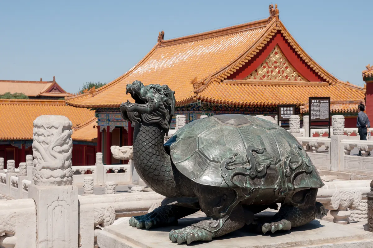 Crowded tourist square in Beijing with the Forbidden City entrance